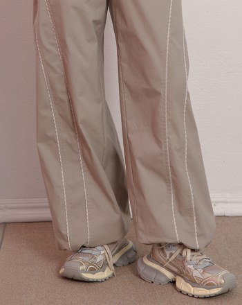 S型花邊剪接造型抽繩寬褲(兩色)